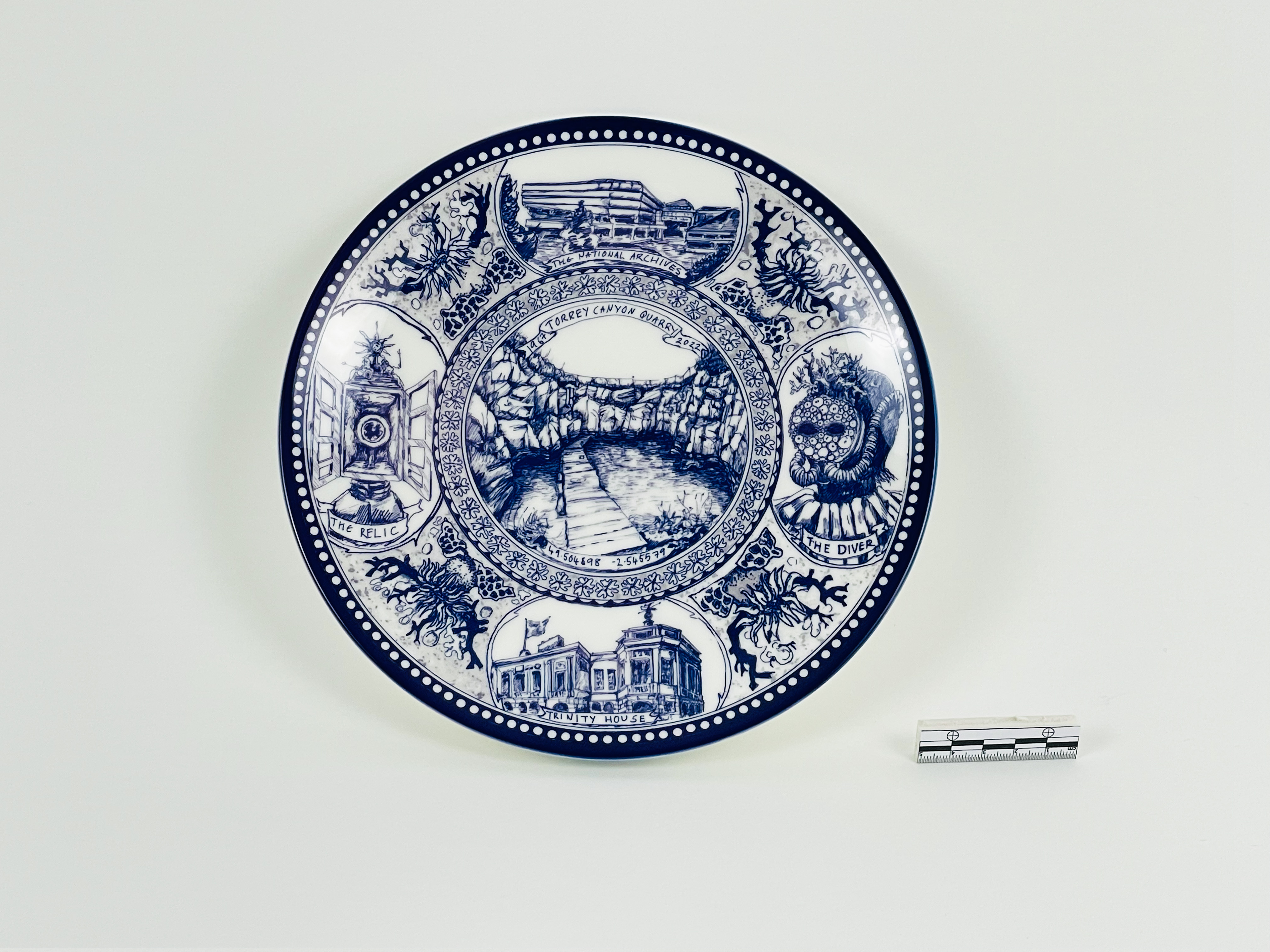 A commemorative plate depicting Torrey Canyon artifacts